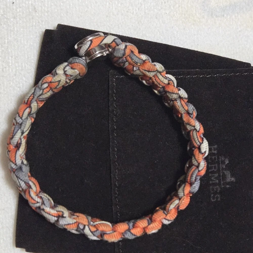 Authentic HERMES Silk Twill Kid Bracelet in Orange.